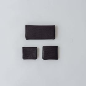 COSMIC WONDER monogram embossed light leather bifold wallet