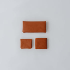 COSMIC WONDER monogram embossed light leather bifold coin case
