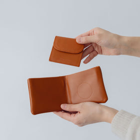 COSMIC WONDER monogram embossed light leather bifold wallet