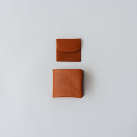COSMIC WONDER monogram embossed light leather bifold wallet