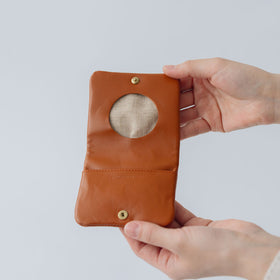 COSMIC WONDER monogram embossed light leather bifold coin case