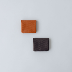COSMIC WONDER monogram embossed light leather bifold coin case
