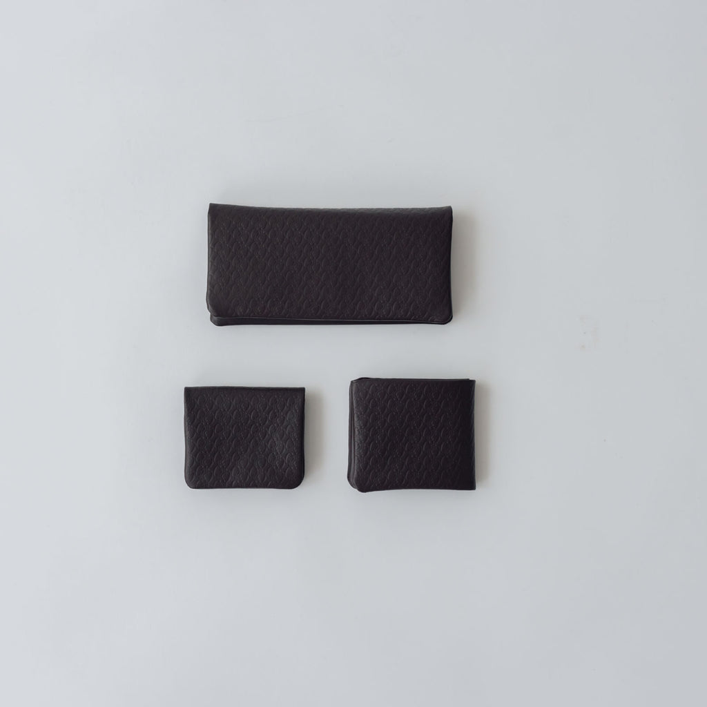 COSMIC WONDER monogram embossed light leather bifold wallet