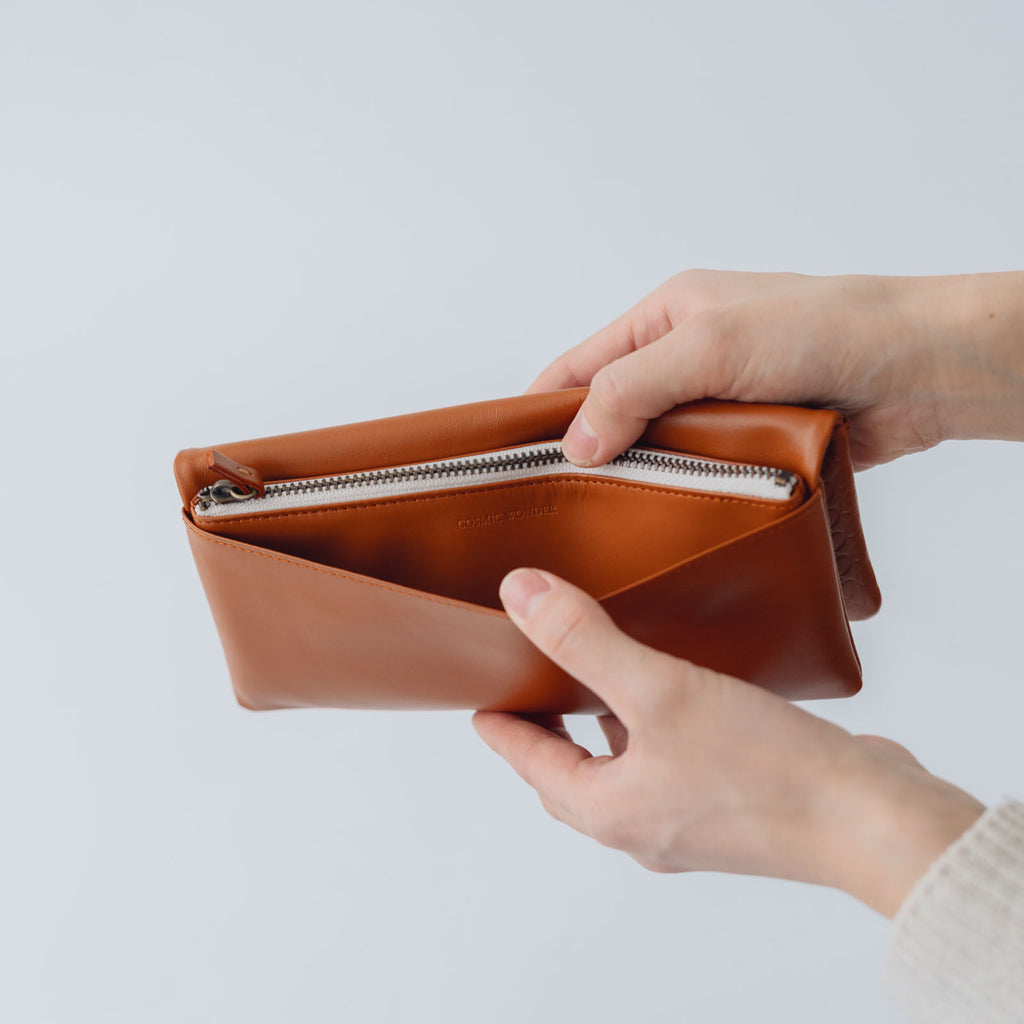 COSMIC WONDER monogram embossed light leather wallet