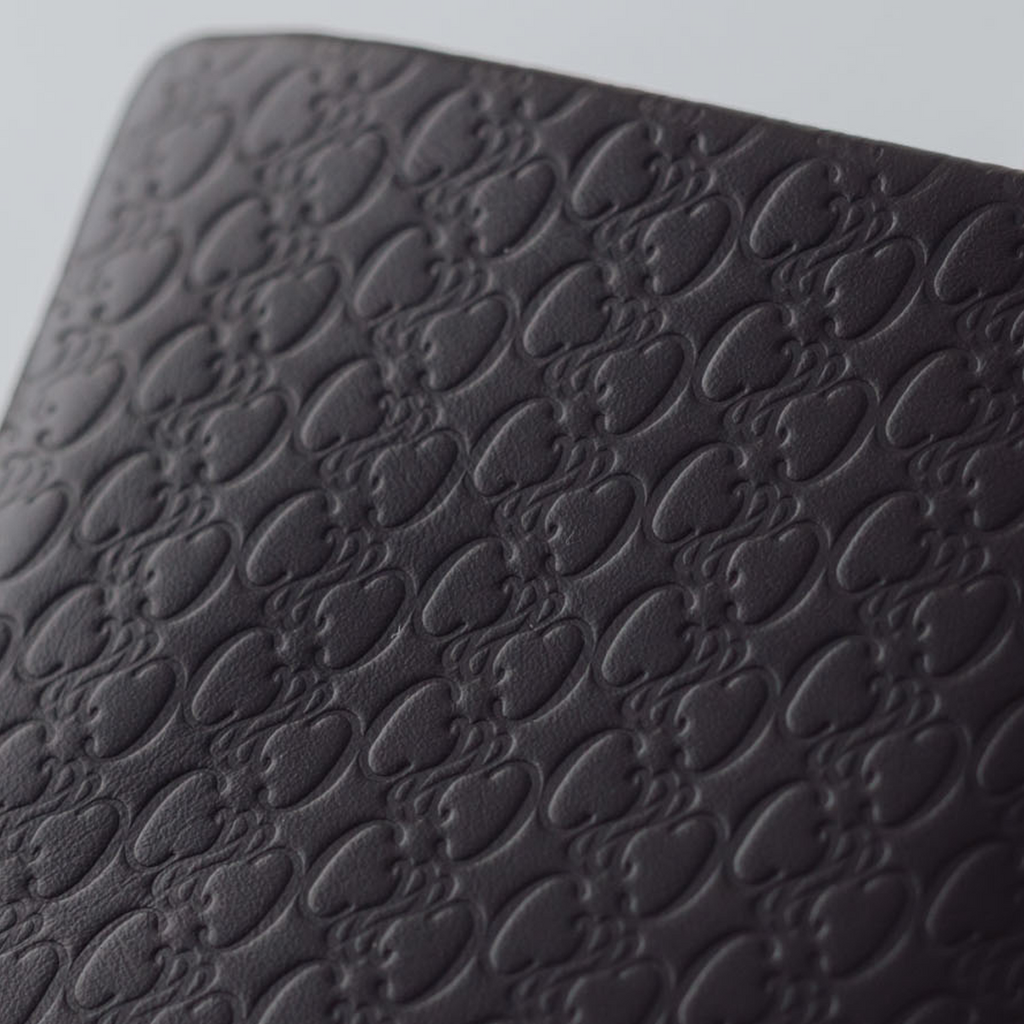 COSMIC WONDER monogram embossed light leather wallet