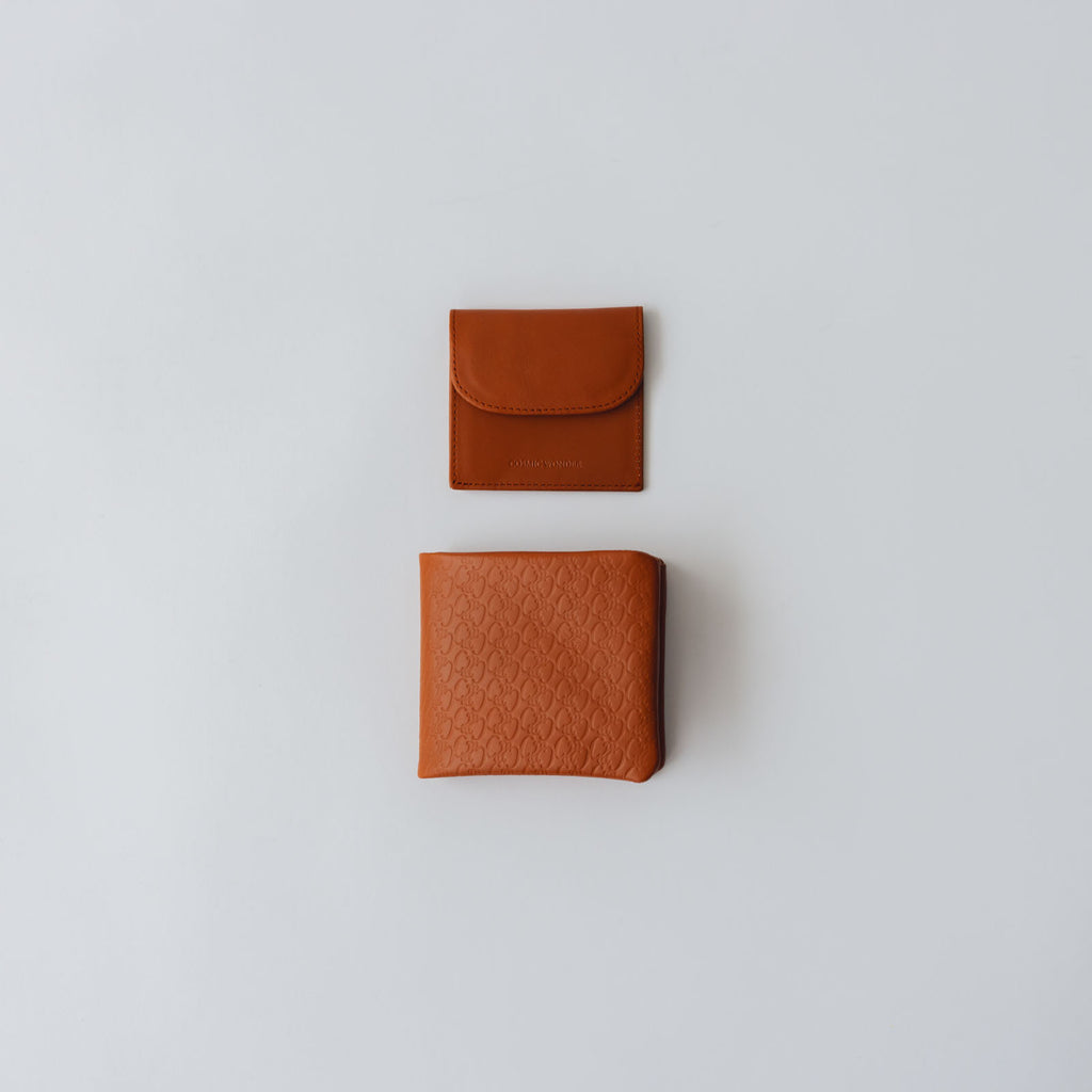 COSMIC WONDER monogram embossed light leather bifold wallet