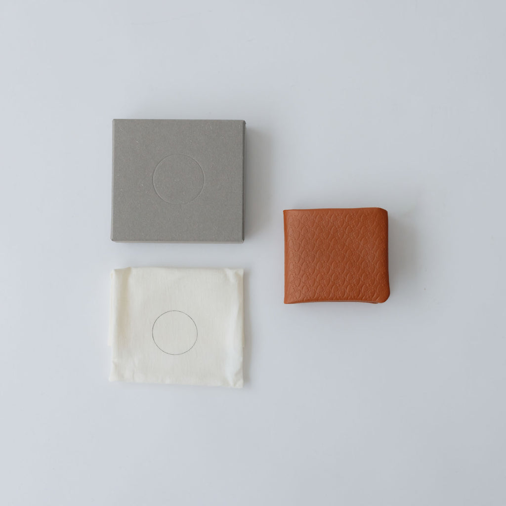 COSMIC WONDER monogram embossed light leather bifold wallet