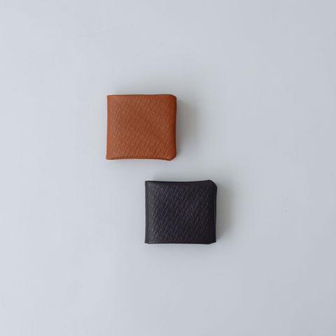 COSMIC WONDER monogram embossed light leather bifold wallet