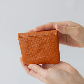 COSMIC WONDER monogram embossed light leather  bifold coin case