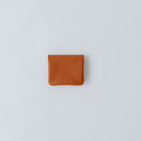 COSMIC WONDER monogram embossed light leather  bifold coin case