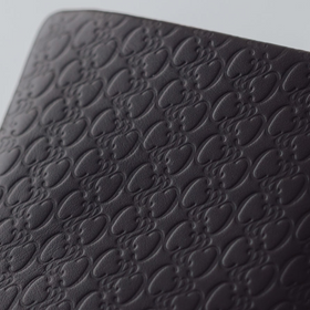 COSMIC WONDER monogram embossed light leather  bifold coin case
